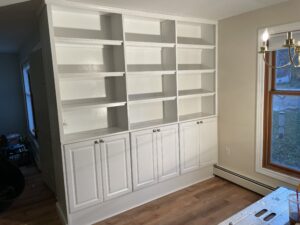 We remodeled about 3/4ths of this Petoskey home after a winter pipe burst destroyed much of the interior. We added this bookcase to help the family pull it all together with some elegant storage.